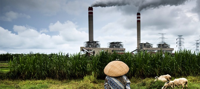 climate-change-woman-chimneys-2.jpg