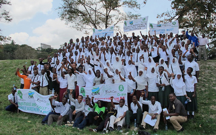 Eluka and Student Marchers walking down street for climate, in Dar es Salaam, Tanzania