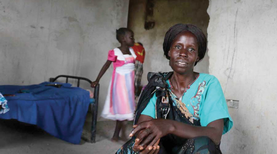 eliza-with-her-daughter-in-the-background-credit-stella-madete-oxfam.jpg