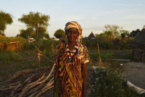 rachel_nyakier_stands_in_front_of_her_land_bare_of_any_crops_due_to_unpredictible_and_unreliable_rains-stella_madete-oxfam.jpeg