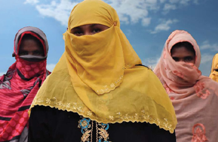 Women standing in veils