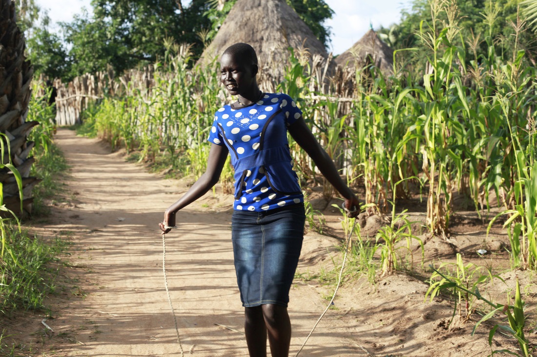 Young woman skipping