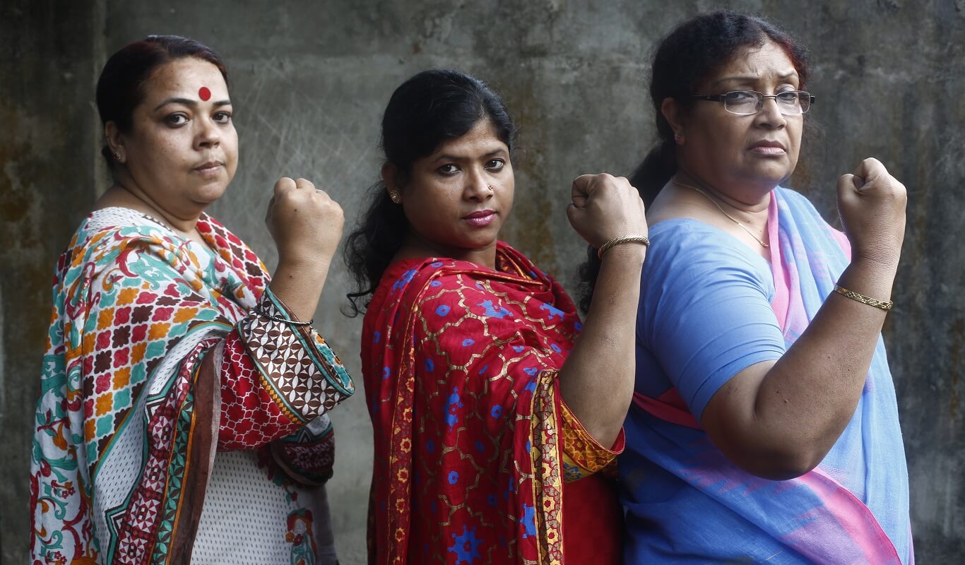 Rownak Ara Haque, Shahnaj Parvin and Shamim Ara Begum of Pollisree pose as empowered women fighting for their rights as part of the Creating Spaces project. Rangpur, Bangladesh (2018).