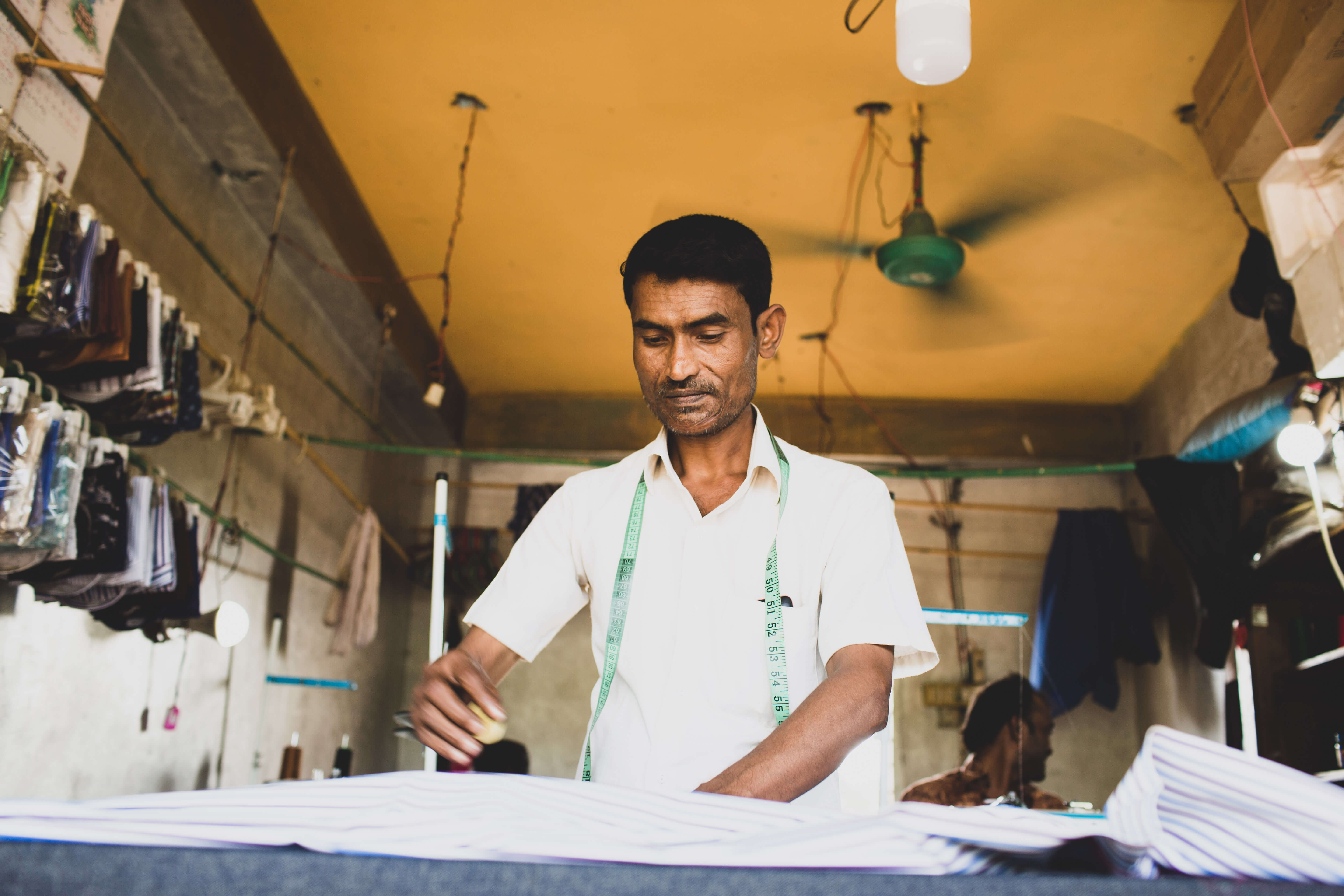 Noor Mohammed in his shop Credit: Caroline Leal/OXFAM