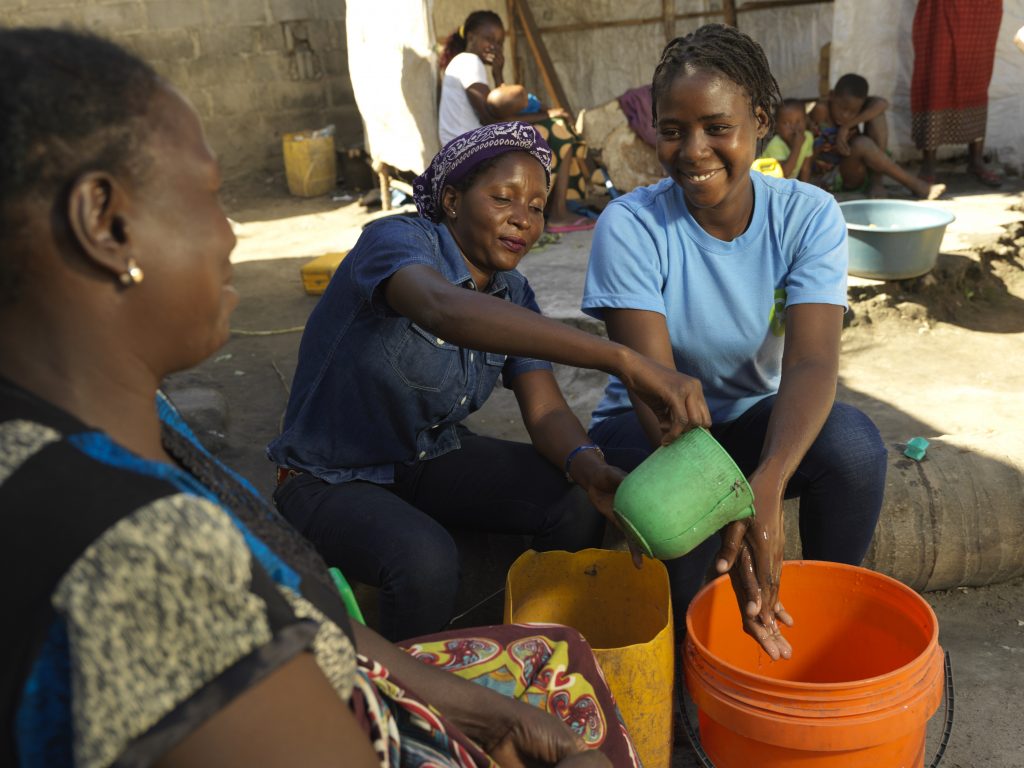women washing hands after Cyclone Idai, Mozambique
