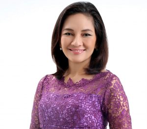 Filipino Senator Risa Hontiveros stands in a casual pose.