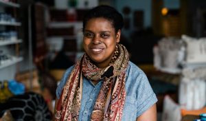 Black woman smiling to the camera