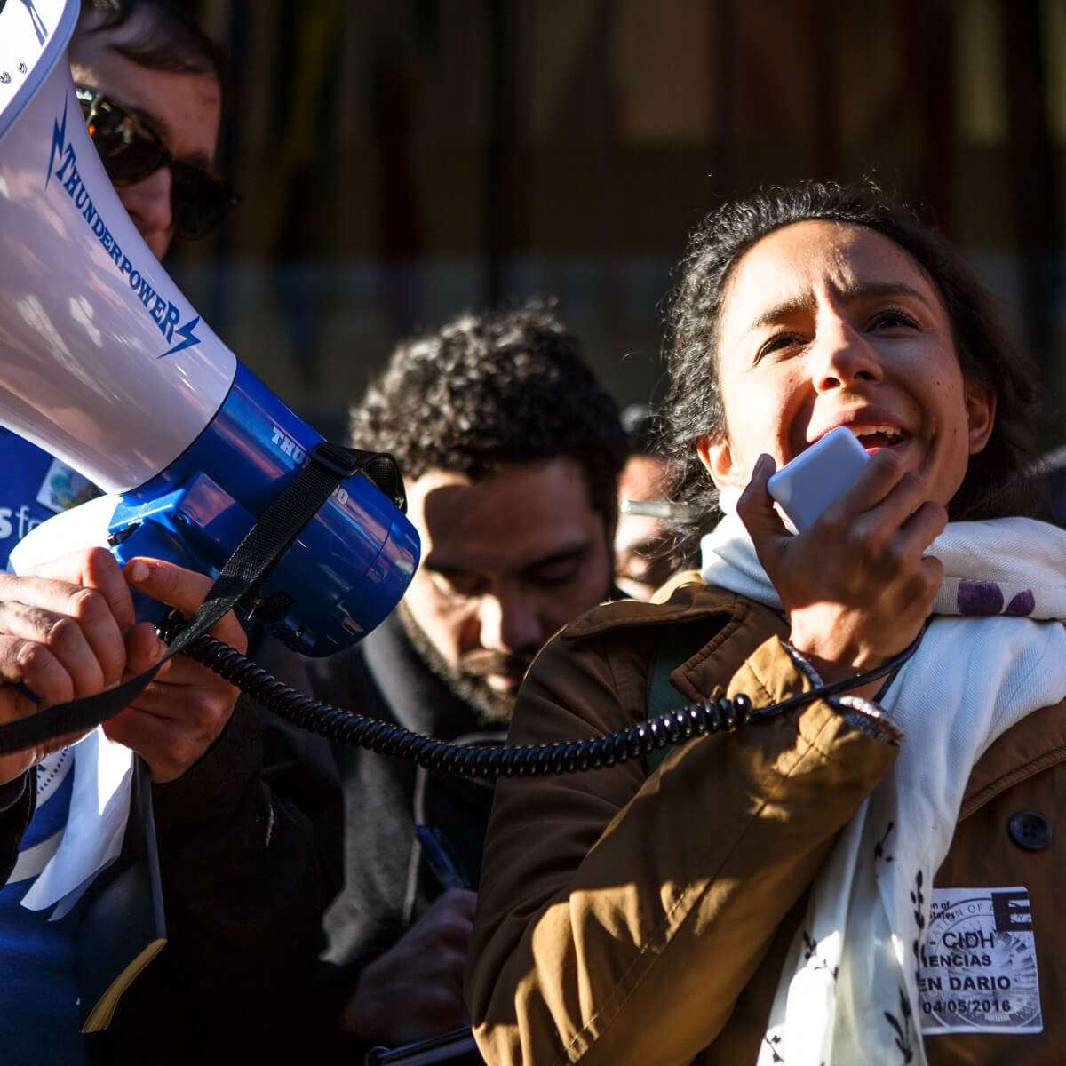 A woman speaking into a megaphone