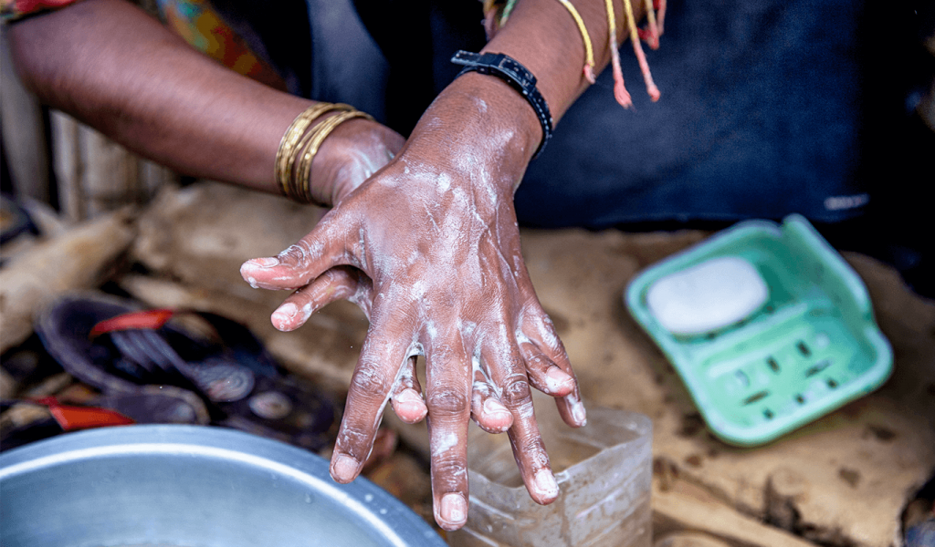 Woman washing hands.
