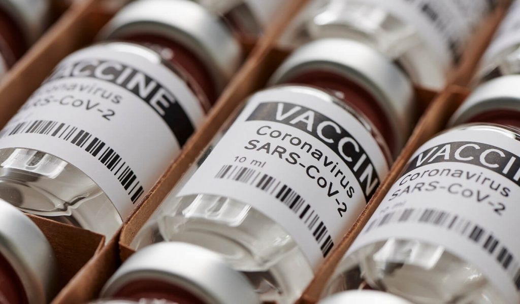 An open flat of COVID-19 vaccines that read "VACCINE: Coronavirus SARS-COV-2