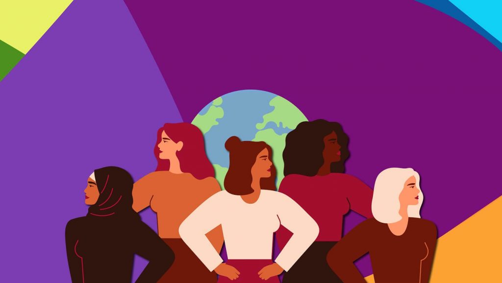 An illustration in which 5 women of various races and identities pose in front of an illustration of the earth. The background is large geometric blocks of colour - purple, yellow, blue and green.