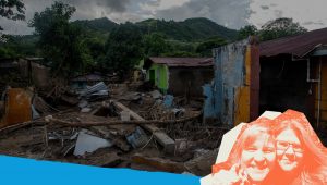 A photo collage of two women, Lori and Sasha standing in front of the remains of a house that’s walls and roof have fallen after a hurricane.