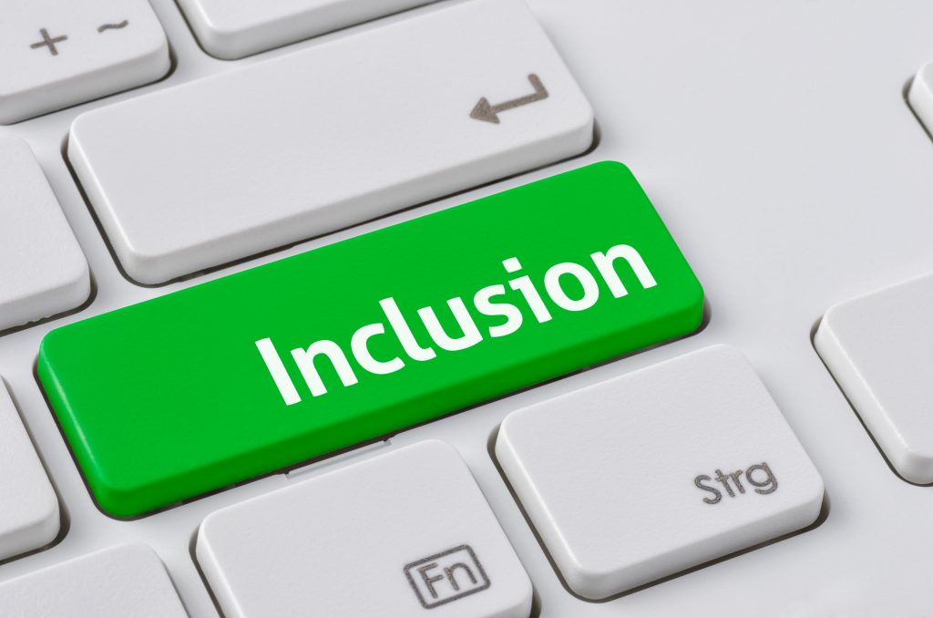 A keyboard with a green button saying Inclusion