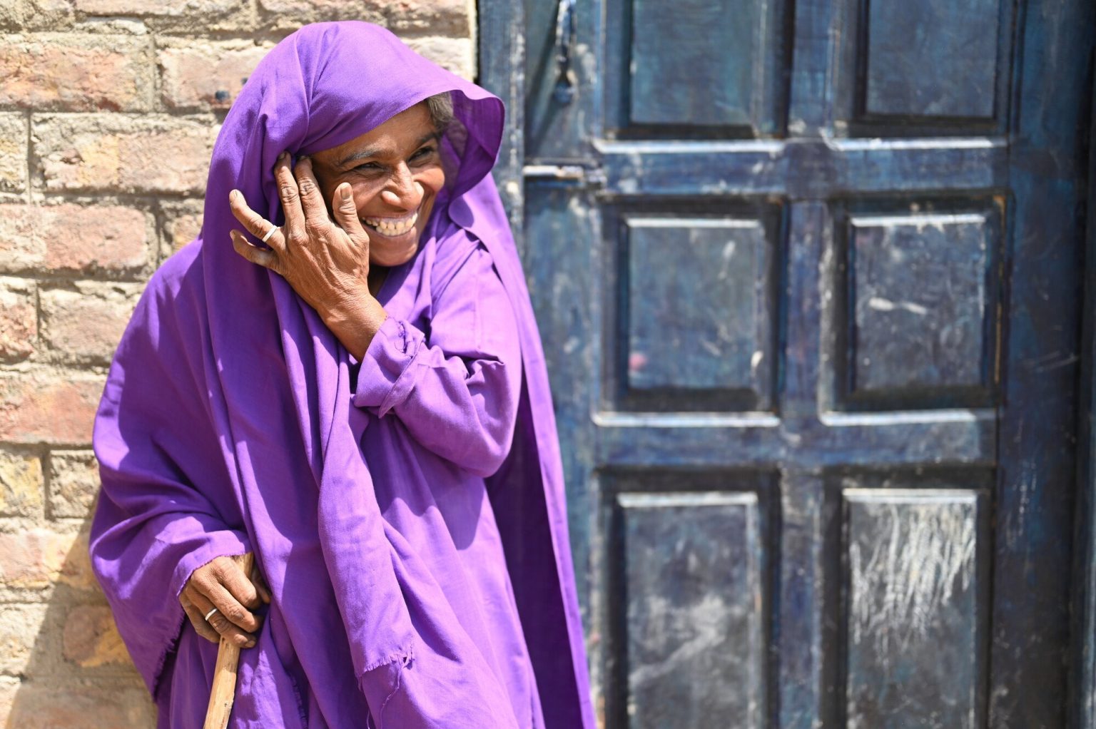 Kizban, 50, says her village did not have proper toilets before the 2022 floods inundated the area. Since a new latrine was installed near her home, she says she worries less about her daughter when she needs to use the facilities at night. Tooba Niazi/Oxfam