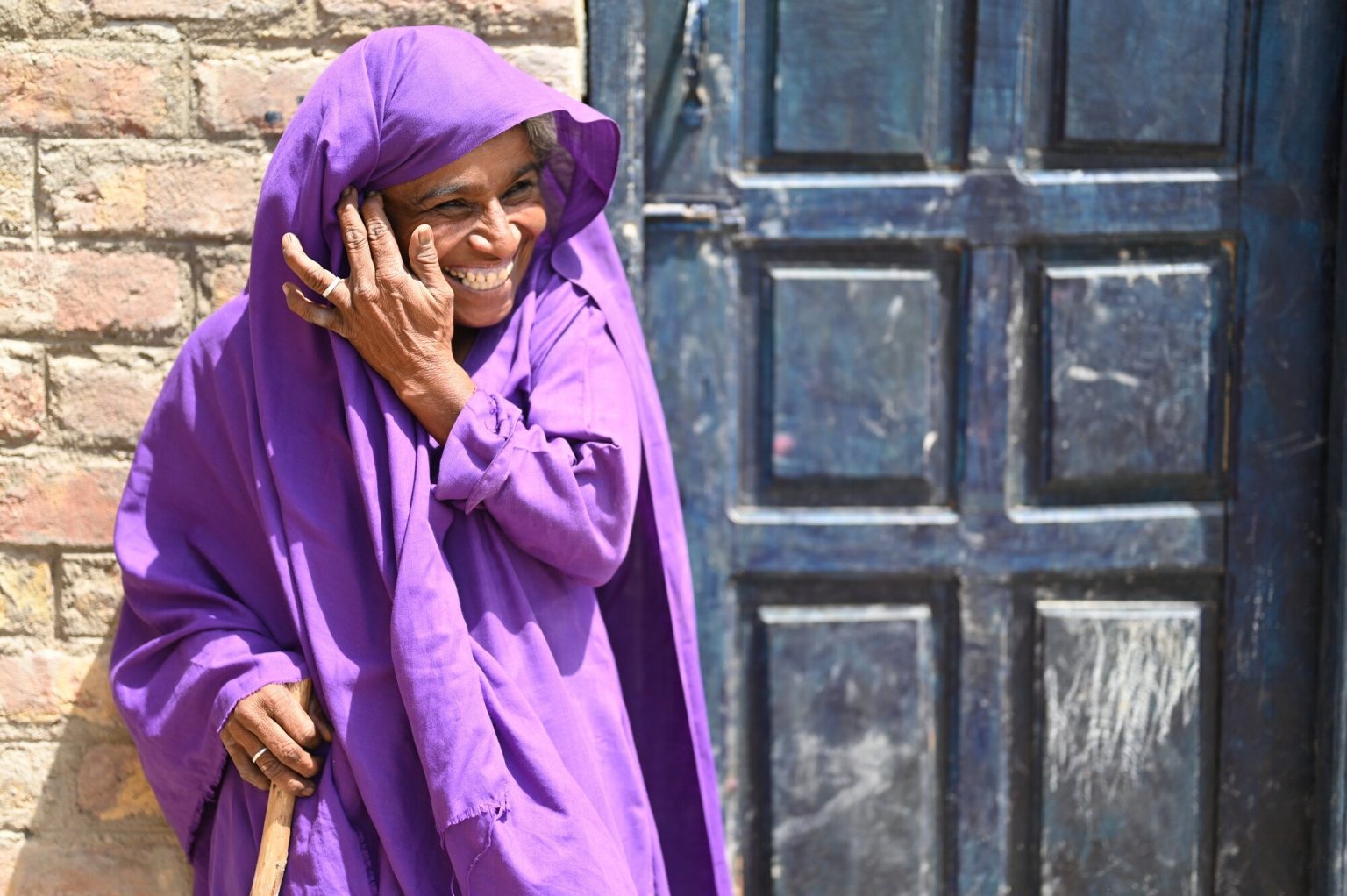Kizban, 50, says her village did not have proper toilets before the 2022 floods inundated the area. Since a new latrine was installed near her home, she says she worries less about her daughter when she needs to use the facilities at night. Tooba Niazi/Oxfam Kizban, 50, says her village did not have proper toilets before the 2022 floods inundated the area. Since a new latrine was installed near her home, she says she worries less about her daughter when she needs to use the facilities at night. Tooba Niazi/Oxfam