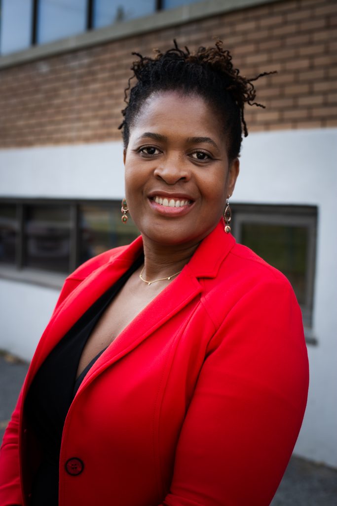 Paulette Senior photo of a black woman wearing a red blazer