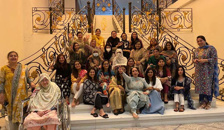 A group of women from Pakistan posing for a group photo.