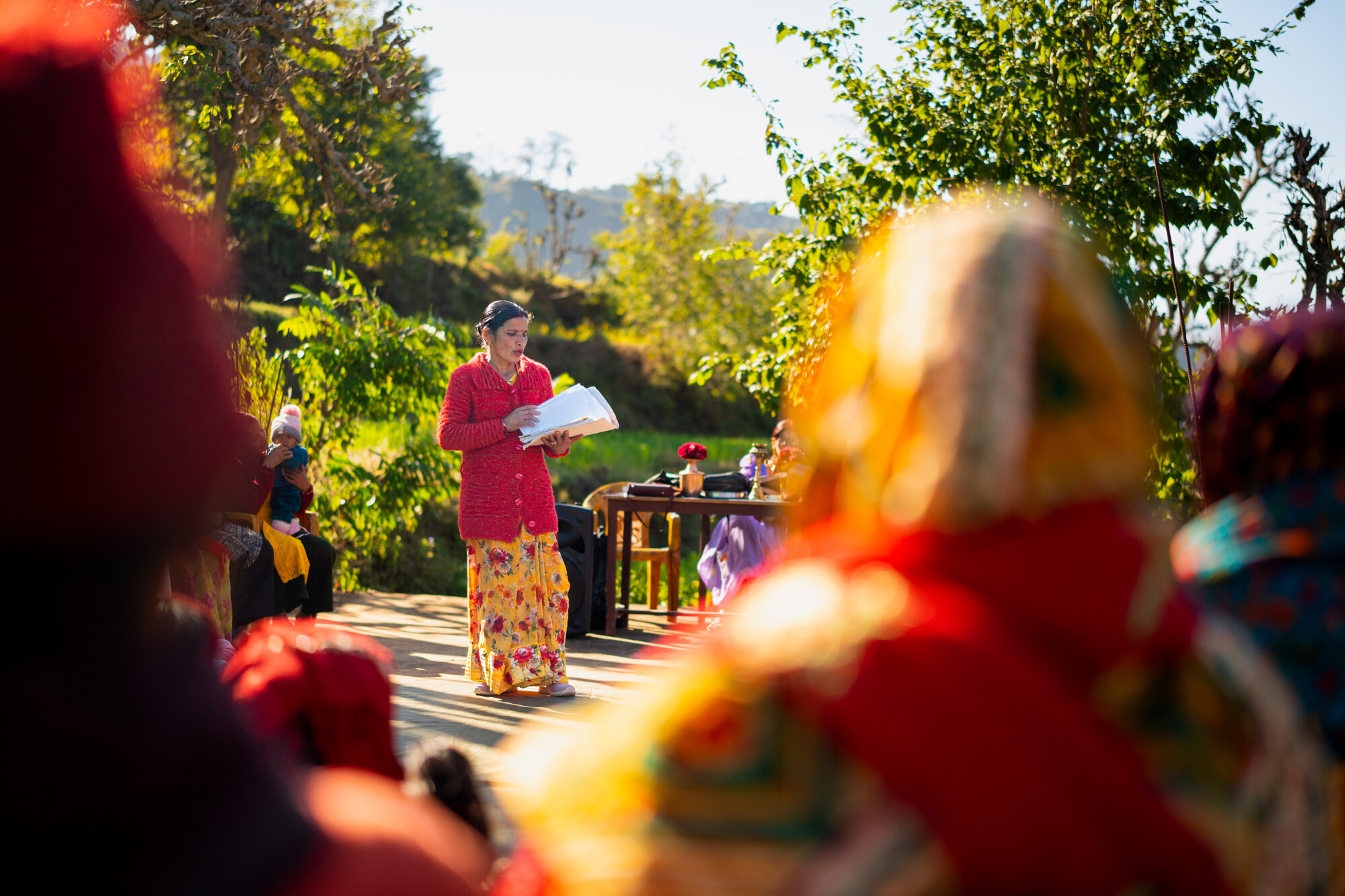 Pramila Bhul speaking to members of a Women's Cooperative during its annual meeting. Photo: Rashik Maharjan/Oxfam