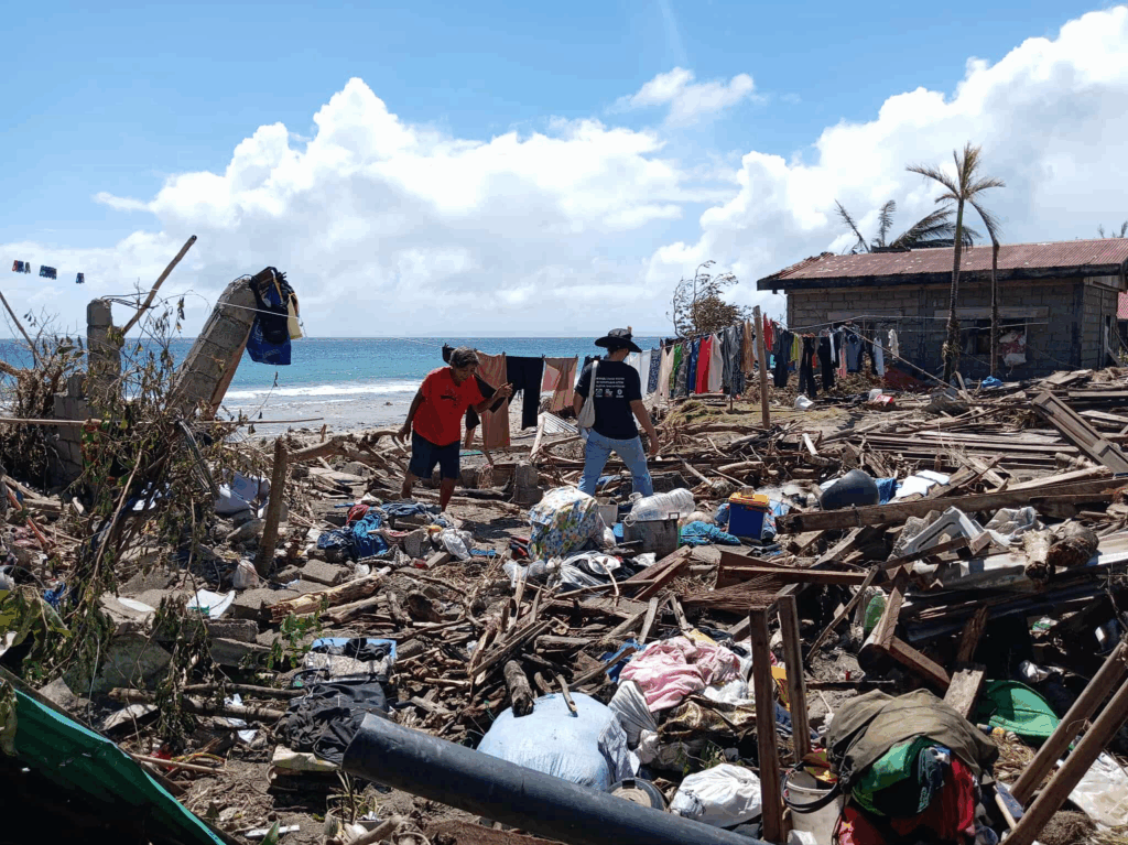 Residents in San Fernando, Masbate search through the remains of their homes after Severe Tropical Storm Opong (Bualoi) tore through coastal communities, leaving widespread damage and debris.