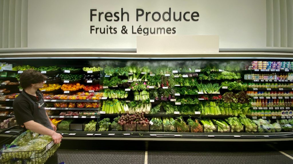 Fresh produce aisle at a grocery store in Canada.