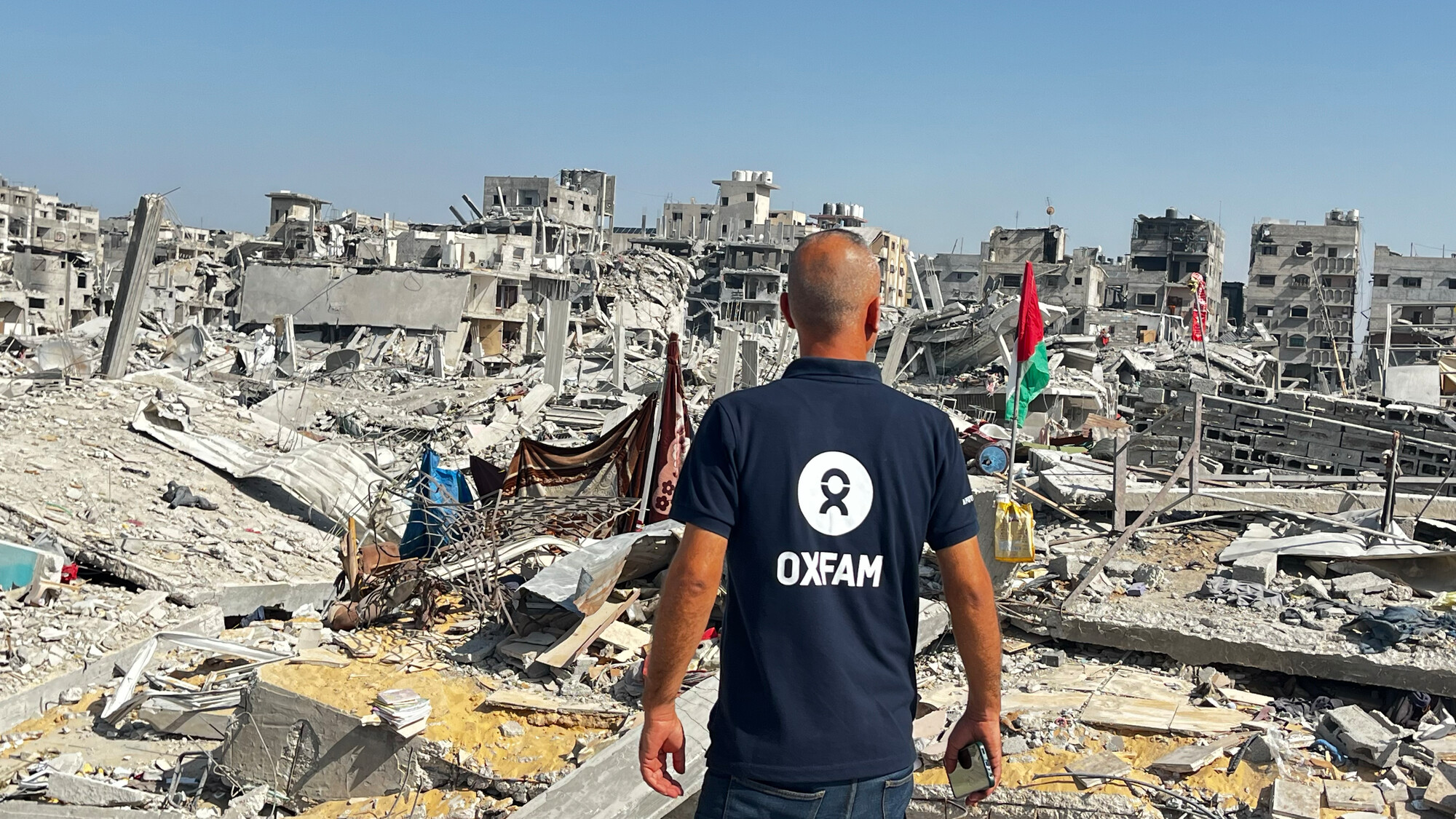 Oxfam Staff Ihab stands in Gaza City after the ceasefire has been declared