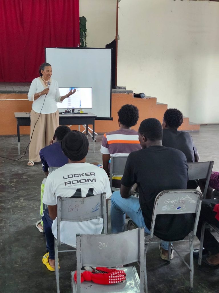 Colleen speaking at a high school close-out ceremony. Photo: The Violence Prevention Alliance