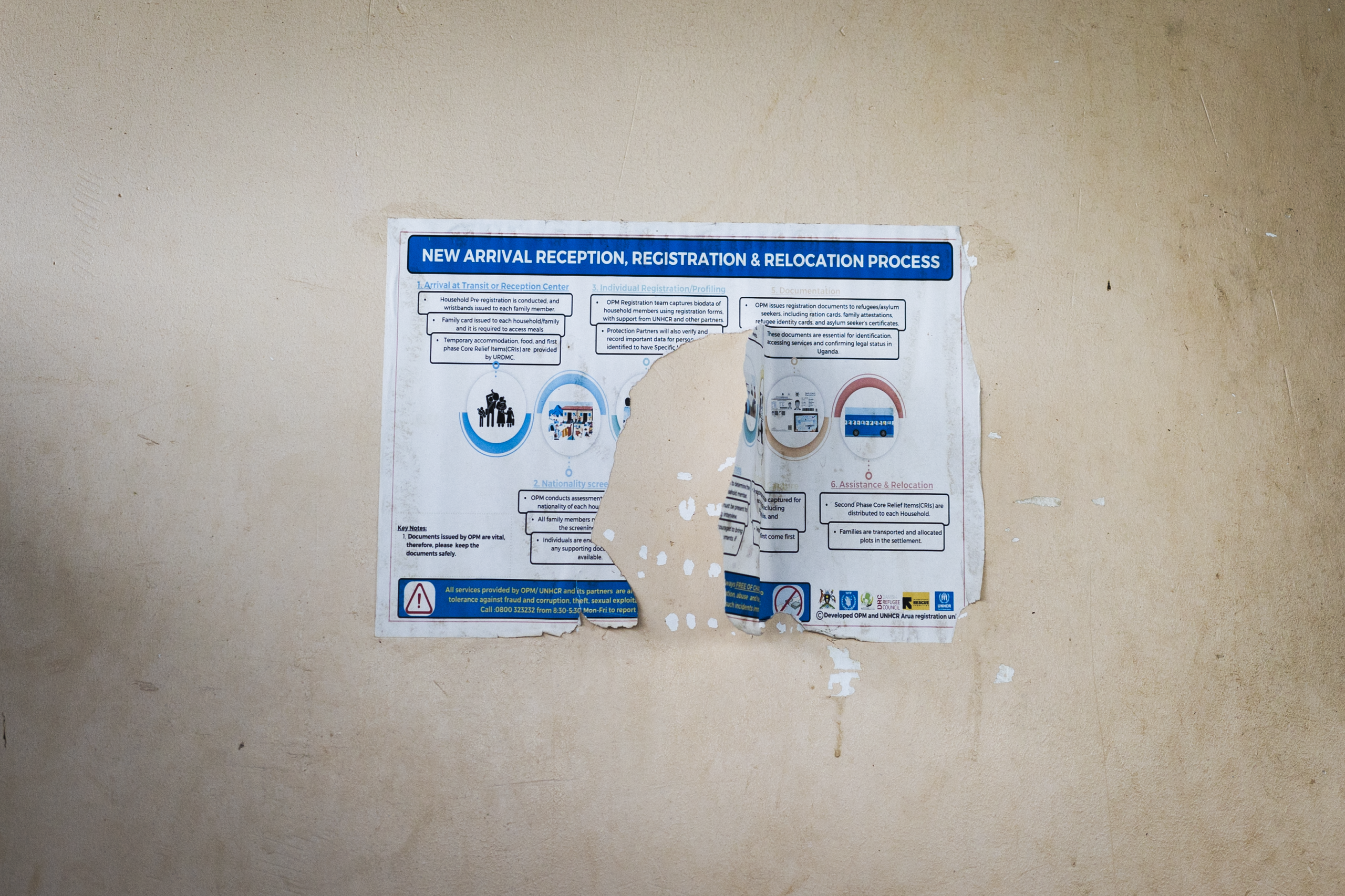 New arrival reception poster at Imvepi Refugee Settlement. Photo: Mikaela Roberts / Oxfam