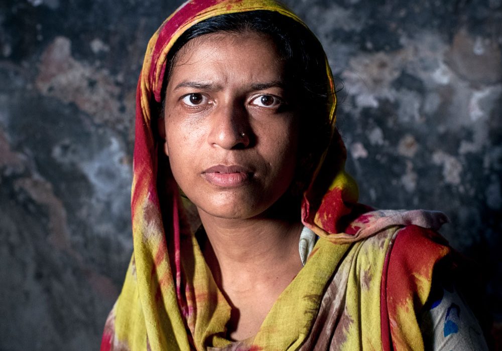 GenderJust_Hero2 A woman with a serious expression faces the camera.