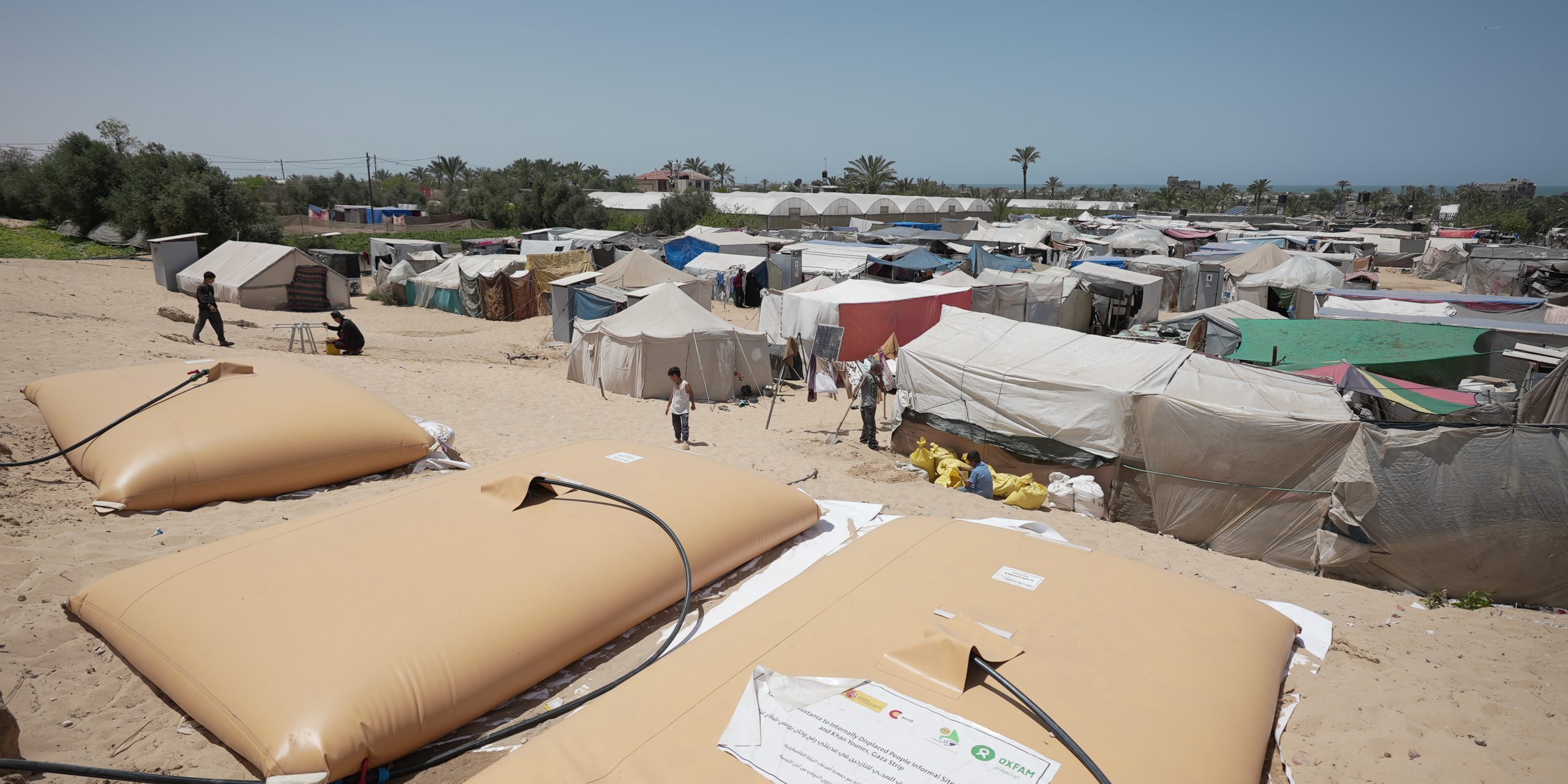As part of Oxfam's WASH services in Gaza, the response includes installing bathrooms, water bladders, handwashing stations, domestic water systems, and distributing water taps in various areas of southern Gaza.