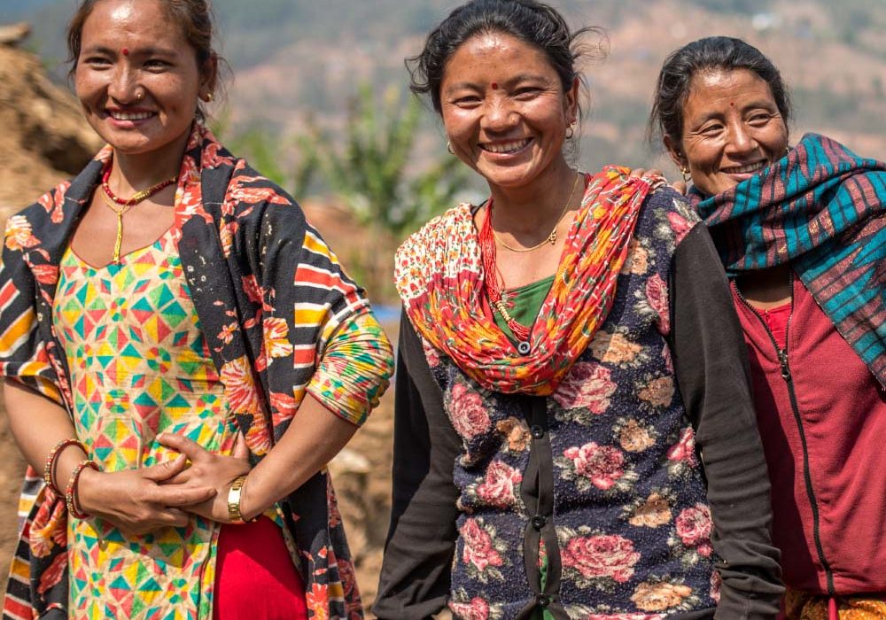 Oxfam and You_SharePlan2 A group of women laugh.