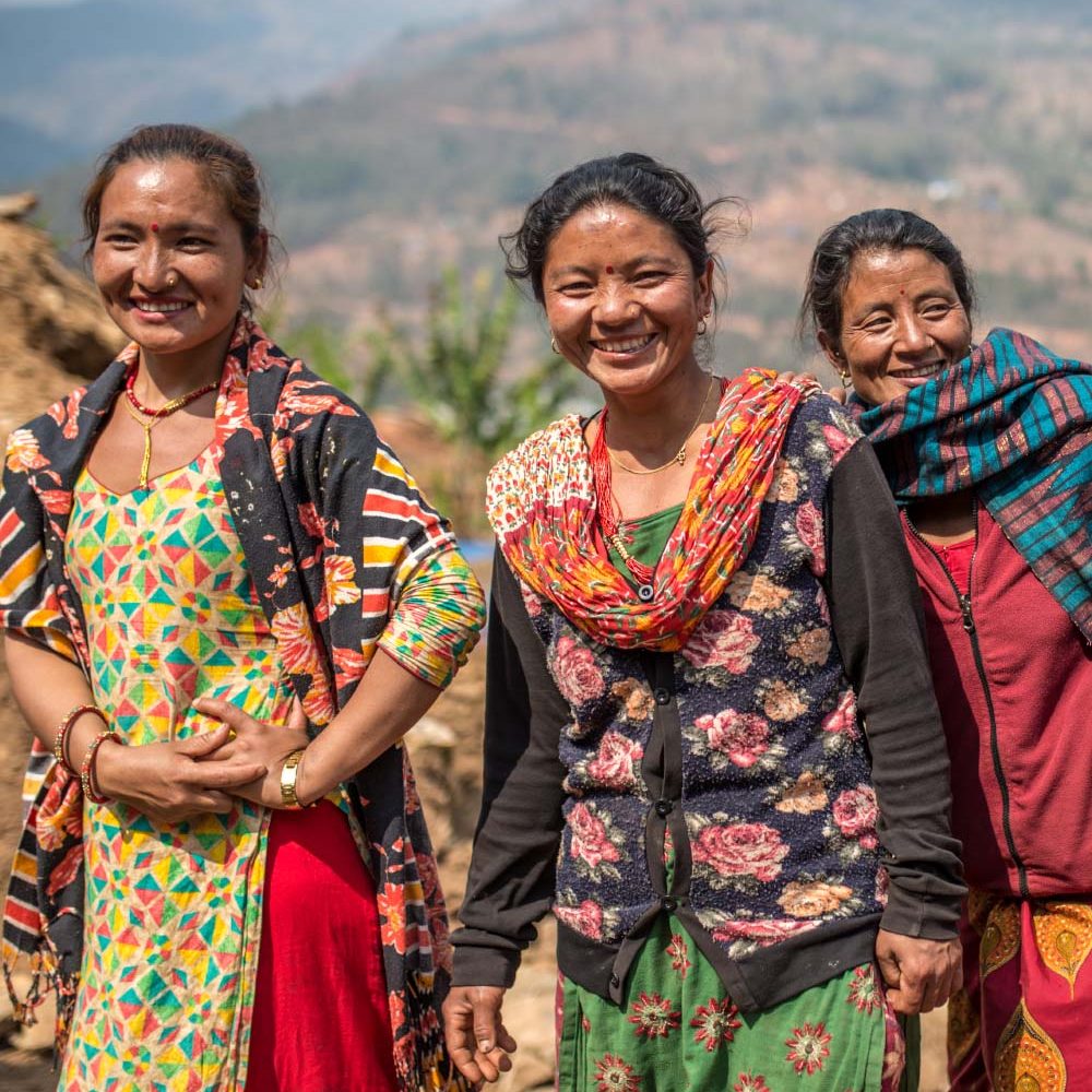Oxfam and You_SharePlan2 A group of women laugh.