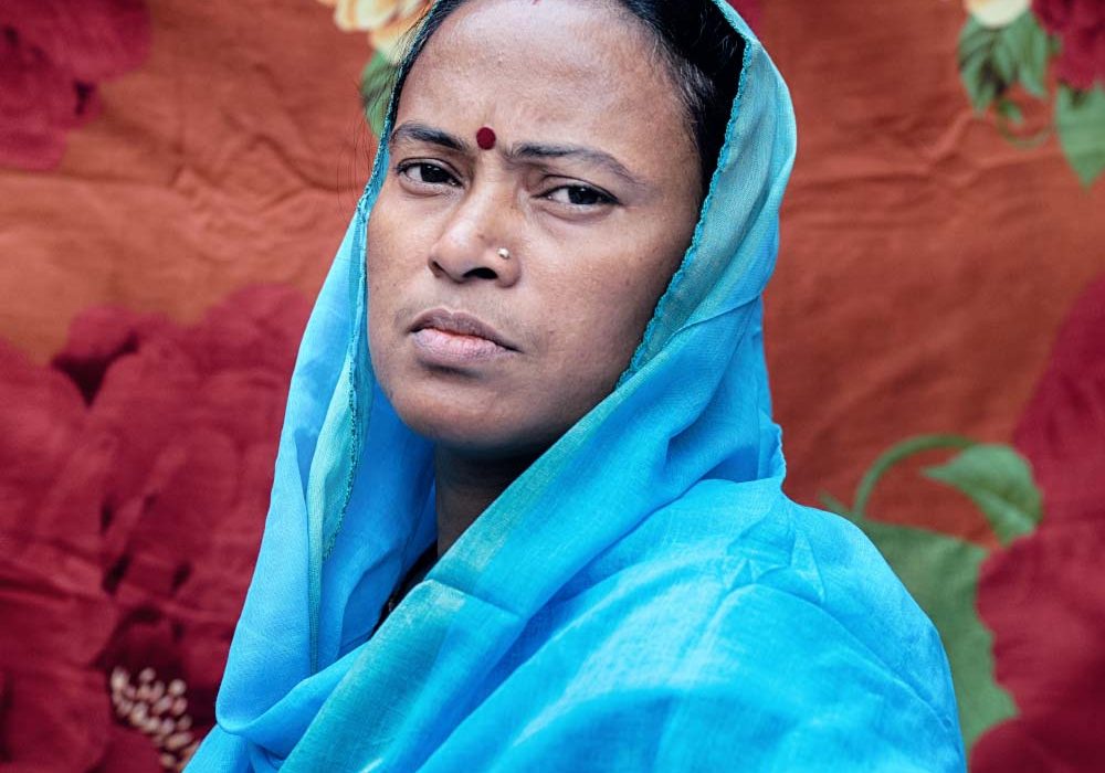 Oxfam and You_WhatSheMakes2 A woman with a serious expression faces the camera.