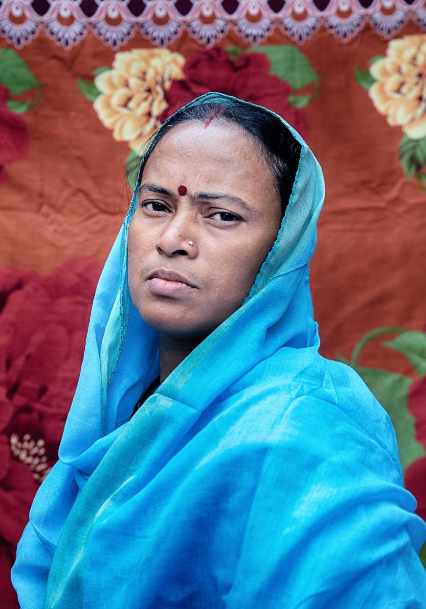 Oxfam and You_WhatSheMakes2 A woman with a serious expression faces the camera.