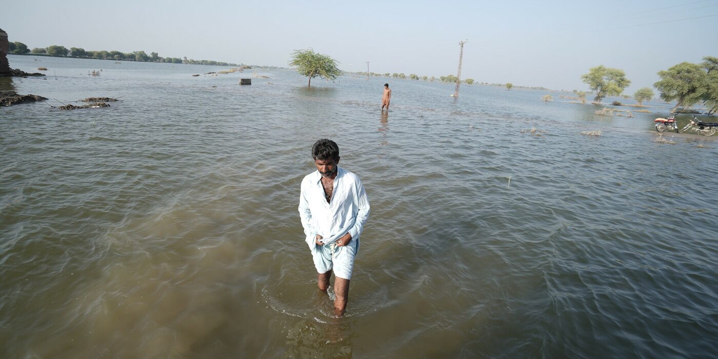 Ghulam Fareed, a flood affectee walks toward the camera. Unusually heavy monsoon rains which began in mid-June (2022) led to severe flooding across the country causing human and livestock casualties as well as widespread destruction of homes and infrastructure.