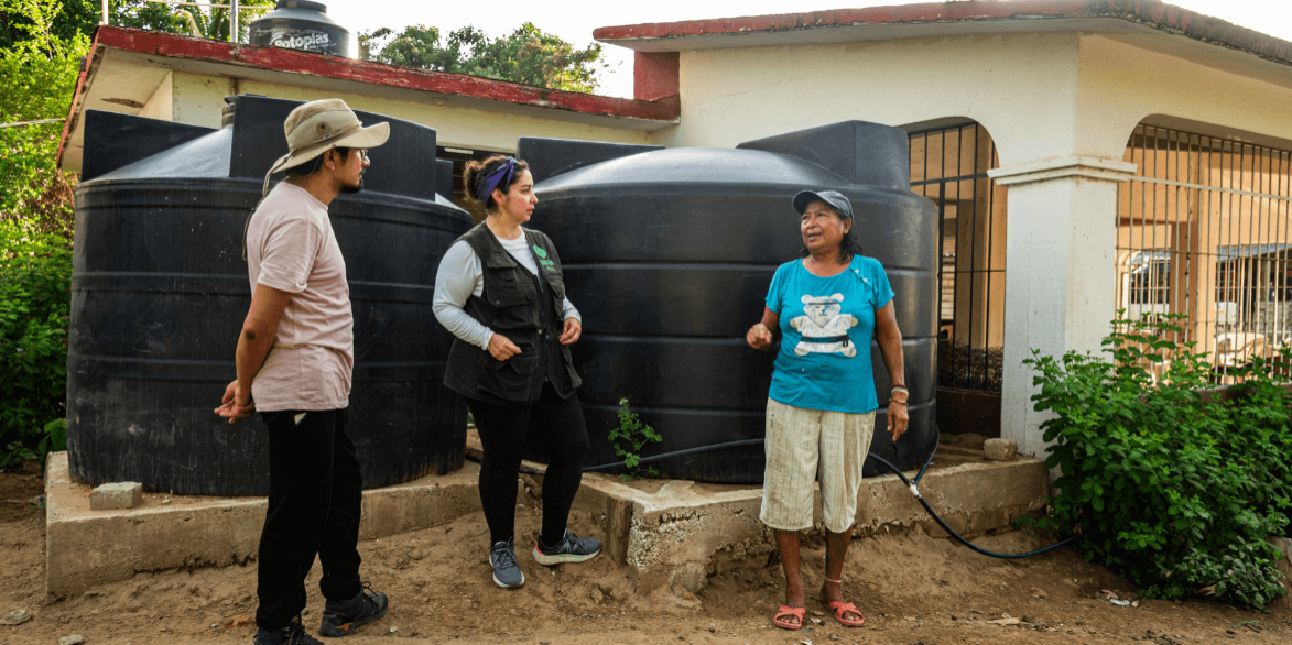 A community member enjoys safe and clean water. Photo: Oxfam Mexico
